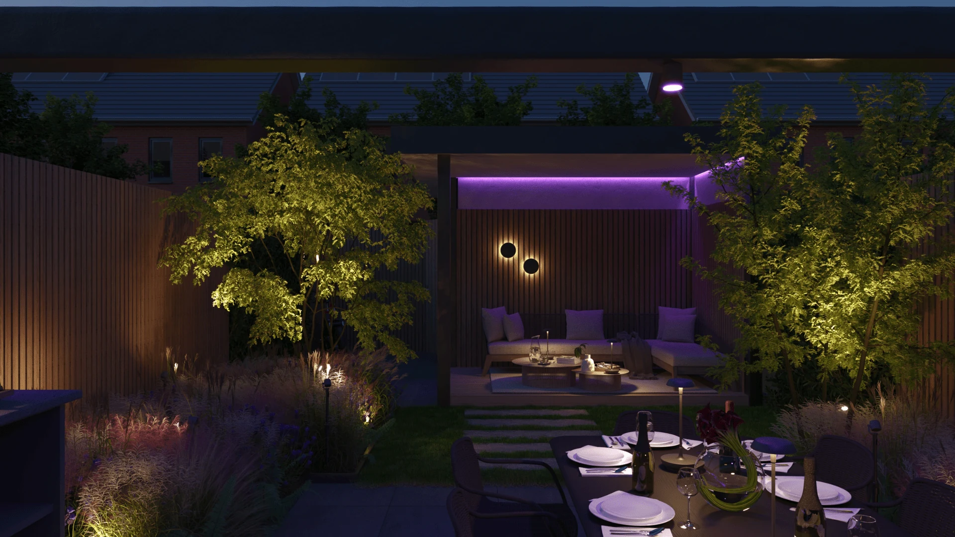 Slimme in-lite verlichting in een avondtuin met eettafel en lounge